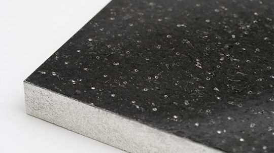 Black Galaxy Steinfurnier auf geblähtem Glas-Recycling-Granulat, Steinoberfläche matt geschliffen und perforiert